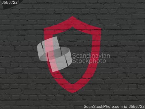 Image of Protection concept: Contoured Shield on wall background