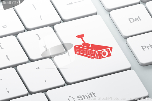 Image of Privacy concept: Cctv Camera on computer keyboard background
