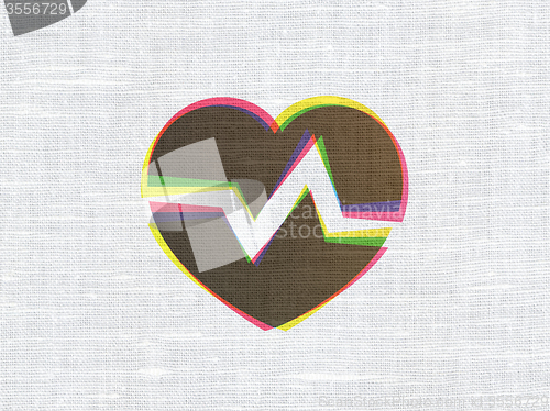 Image of Medicine concept: Heart on fabric texture background