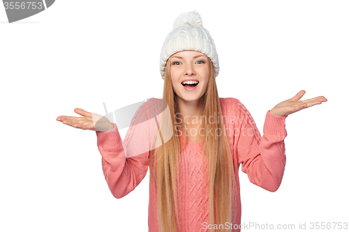 Image of Excited surprised winter girl