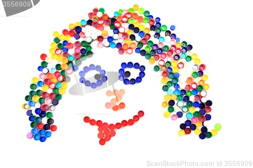 Image of color plastic caps as human face 