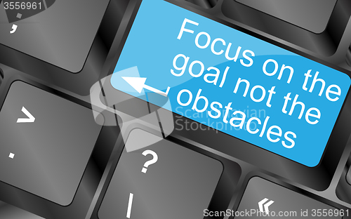 Image of Focus on the goal not the obstacles. Computer keyboard keys with quote button. Inspirational motivational quote. Simple trendy design