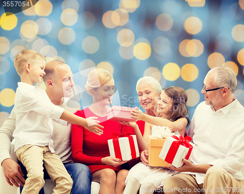 Image of smiling family with gifts