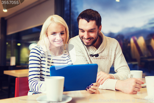 Image of happy couple with tablet pc and coffee at cafe