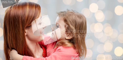 Image of happy mother and little daughter hugging