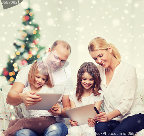 Image of happy family with tablet pc computers at home