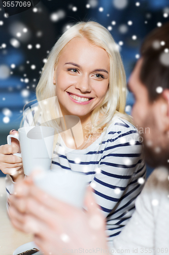 Image of happy couple meeting and drinking tea or coffee