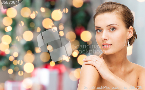 Image of beautiful woman with diamond earrings and bracelet