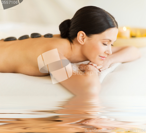 Image of woman in spa with hot stones