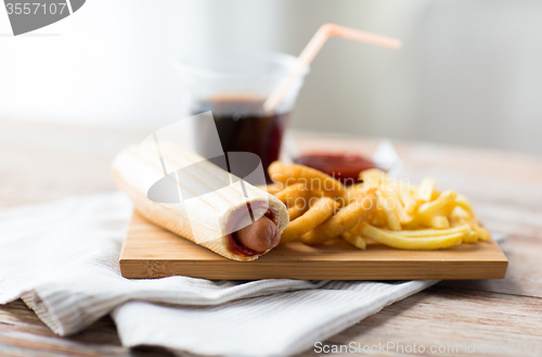 Image of close up of fast food snacks and drink on table