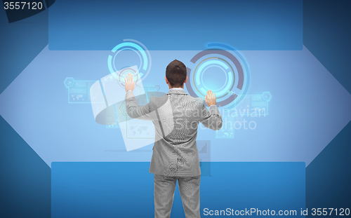 Image of businessman in suit working with virtual screens