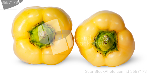 Image of Two yellow bell peppers lying beside