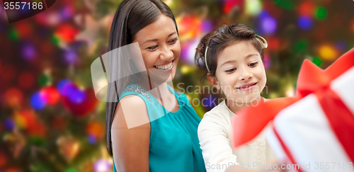 Image of happy mother and child with gift box