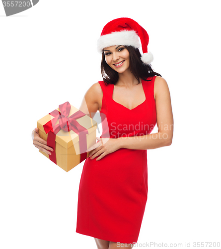 Image of beautiful sexy woman in santa hat with gift box