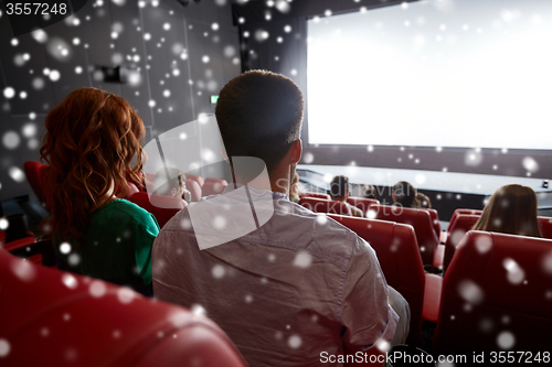 Image of couple watching movie in theater or cinema