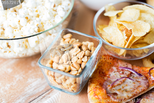 Image of close up of fast food snacks on wooden table