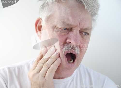 Image of man with pain in cheek