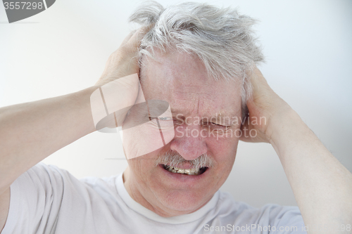 Image of man with severe headache pain