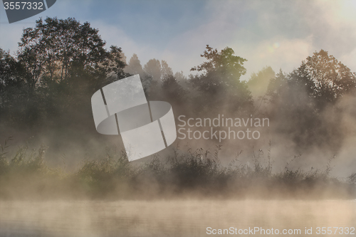 Image of fog and sun  on the river