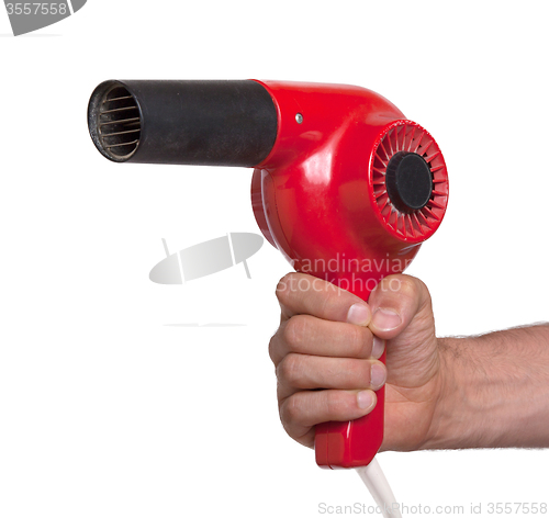 Image of Old red hairdryer in hand