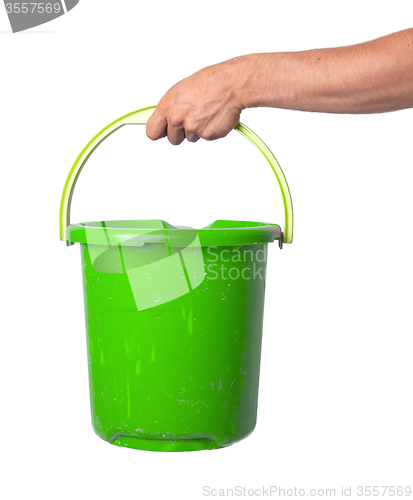 Image of Human hand holding empty plastic pail