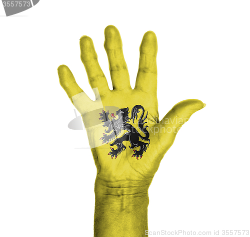 Image of Palm of a woman hand, painted with flag