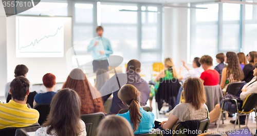 Image of Speaker Giving a Talk at Business Meeting.