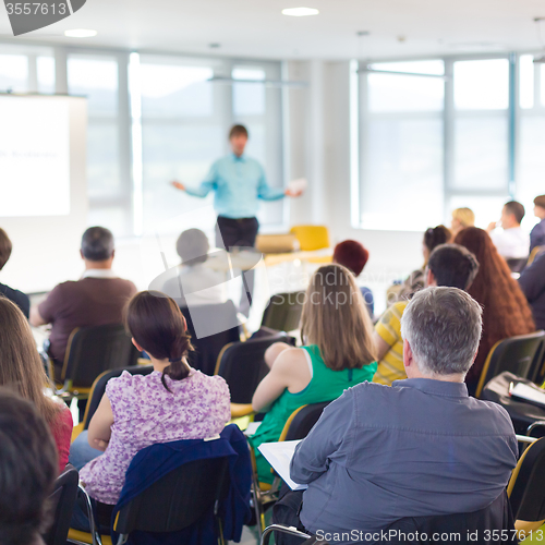 Image of Speaker Giving a Talk at Business Meeting.