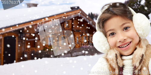 Image of happy little girl wearing earmuffs