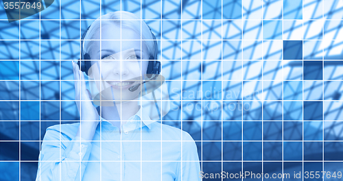 Image of helpline operator in headset over blue grid