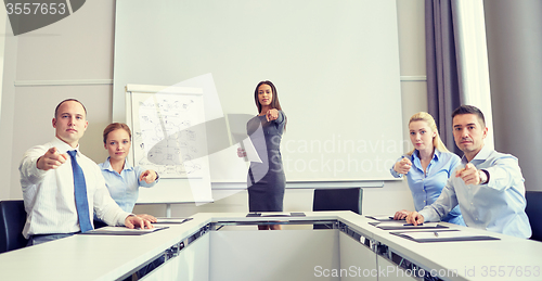 Image of group of businesspeople pointing finger at you