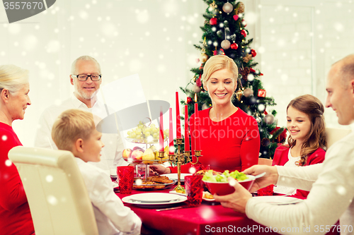 Image of smiling family having holiday dinner at home