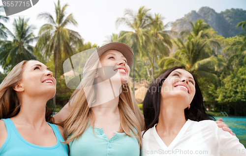 Image of happy young women over resort beach