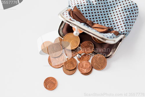 Image of close up of euro coins and wallet on table