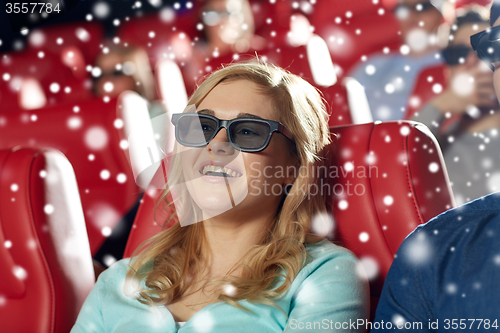 Image of happy young woman watching 3d movie in theater