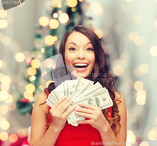 Image of woman in red dress with us dollar money