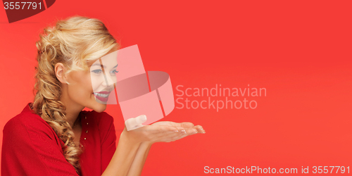 Image of woman holding something on palms of her hands