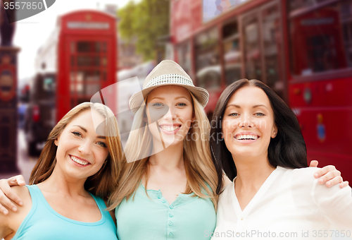 Image of group of happy young women over london city street