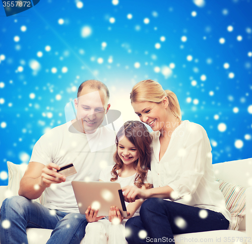 Image of happy family with tablet pc and credit card