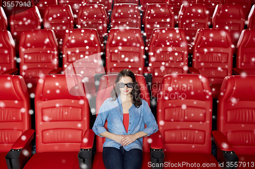 Image of young woman watching movie in 3d theater