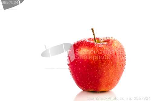 Image of Red apple with water drops.
