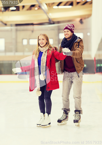 Image of happy couple on skating rink