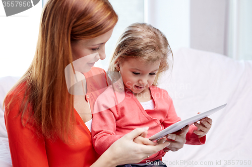 Image of happy mother and daughter with tablet pc computer