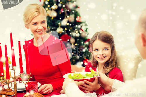 Image of smiling family having holiday dinner at home