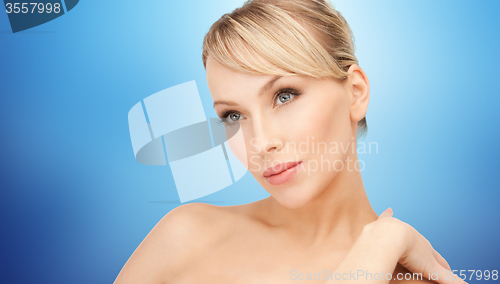 Image of beautiful young woman with bare shoulders