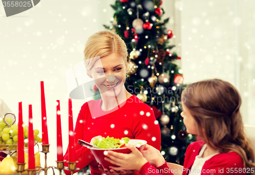 Image of smiling family having holiday dinner at home