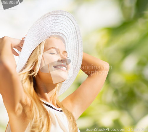 Image of beautiful woman enjoying summer outdoors