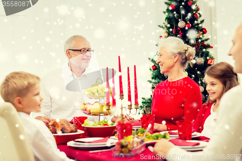 Image of smiling family having holiday dinner at home