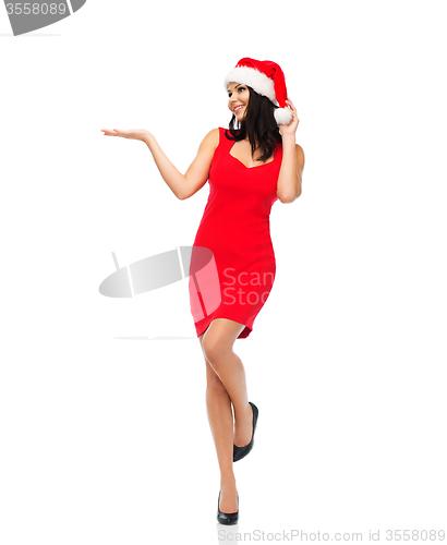 Image of beautiful sexy woman in santa hat and red dress