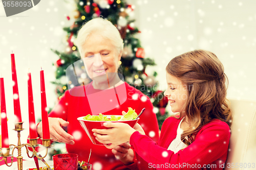 Image of smiling family having holiday dinner at home